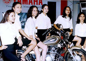 Models sporting a new generation motorbike
