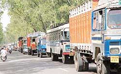 Vehicles line up on the busy Chandigarh-Ambala highway as a tractor-trailer with burst tyres blocked the traffic over the Ghaggar bridge
