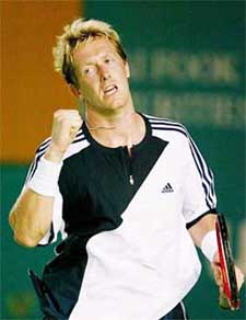 Sweden's Jonas Bjorkman reacts after winning the match against Feliciano Lopez of Spain