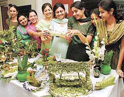 Students of the Dev Samaj College of Education, Sector 36, look at a salad presentation at a contest organised to mark green consumer day