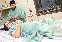 Khalida Mushtaq, a candidate of the NCP, lies critically wounded