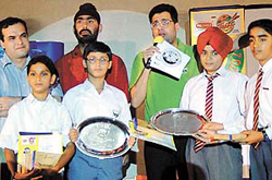 The winners of Discovery Kids quiz contest with their prizes at St Johns School, Sector-26, in Chandigarh on Monday. 