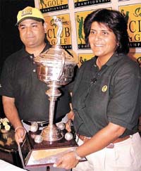 Woman golfer Nonita Lal unveiling the McDowell's Club Golf Championship trophy