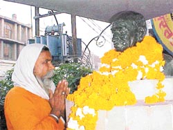 A sadhu pays tributes to Mahatma Gandhi