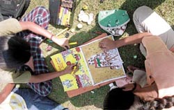 Schoolchildren at a painting competition, organised by the Brotherhood Society