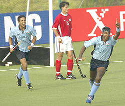 Indias Daljit Singh (R) celebrates after scoring a goal 