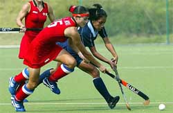Chinas Hou Xiaolan competes with Indias Maimon Sanggai Ibermhal Chanu, right, during the Asian Games