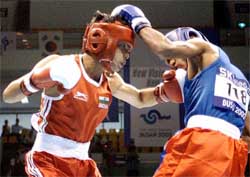 Indias Qamar Md. Ali lands his punch
