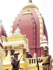 Delhi Police personnel keeping vigil at the famous Birla Temple as part of a new security drill for Durga Puja