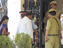 Securitymen frisk visitors at the Birla temple