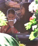 Andrea Walekar comforts her grandmother 