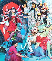 Artist Namita Adhikari gives finishing touches to the idols of Goddess Durga 