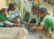 girl students clean utensils afterwards
