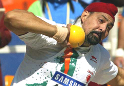 Bahadur Singh Sagoo readies to throw the shot put 