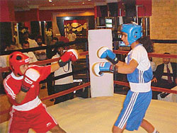 A women’s exhibition boxing match in progress at a Ludhiana hotel