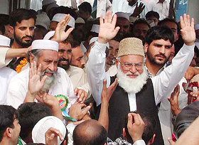 Qazi Hussain Ahmed is received by his supporters