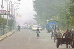 A thick blanket of smong engulfs the city as farmers resort to rampant burning of paddy stubble
