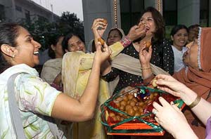 Supporters of the Pakistan Muslim League (QA) rejoice at a party office