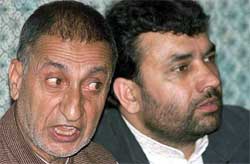 Abdul Ghani Bhat speaks during a news conference