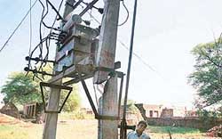 This electricity transformer perched on a damaged concrete pole in Mullanpur-Garibdas village poses a threat to the lives of passersby