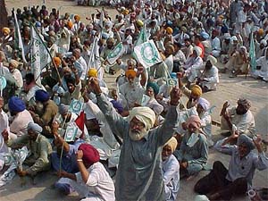 Farmers during a dharna held near the office of the Deputy Commissioner