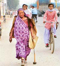 Many women earn their livelihood by collecting iron scrap from roadside with the help of magnets attached to rods
