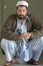 Afghanistans notorious military commander Abdullah Shah sits in Kabuls prison on Wednesday