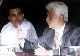 Wipro chairman Azim Premji addresses a news conference