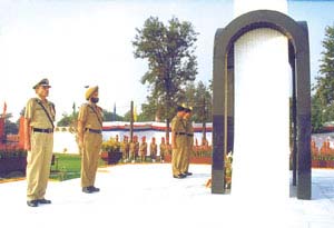 Mr R. C. Aggarwal, Special Director-General, Border Security Force, stands in attention after laying floral wreaths at the BSF Martyrs Memorial in New Delhi