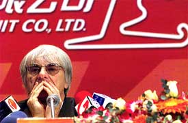 Formula One chief Bernie Ecclestone attends a news conference