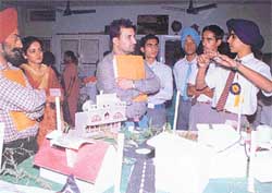 Students explain the working of a model at a science exhibition held at Josephs School