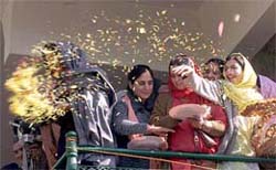 Supporters of the Peoples Democratic Party (PDP) shower petals on their leader, Mufti Mohammed Sayeed