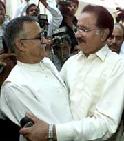 Pakistan Peoples Party leader Makhdoom Amin Fahim is greeted by Mutahidda National Movement leader