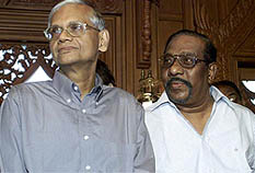Tamil Tiger chief negotiator Anton Balasingham stands with Sri Lankan government chief negotiator