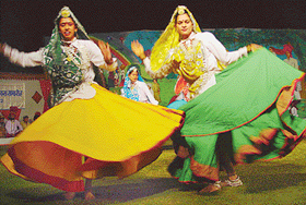 Girls perform Haryanvi dance to mark the Haryana Day celebrations at Haryana Raj Bhavan on Friday.