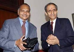 Outgoing Cabinet Secretary T. R. Prasad with his successor