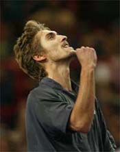 Nicolas Escude of France raises a clenched fist