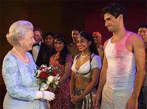 Britain's Queen Elizabethh II greets members of the cast