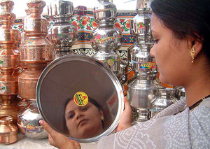 Women purchases utensils at a shop