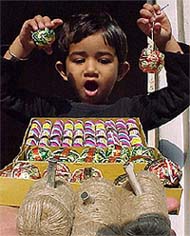 Even as the authorities concerned have imposed a ban on sale and bursting of crackers, a child is amazed while looking at some big crackers