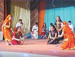 Students of Bhartiya Vidya Mandir present dandiya dance during the annual function of the school