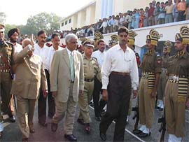 Jammu and Kashmir Chief Minister Mufti Mohammed Sayeed inspects a guard of honour in Jammu