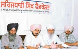 Dr P.S. Ranu, national president of the Sikh Sehajdhari Federation, addresses mediapersons