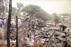 The gutted remains of jhuggis in R. K. Puram
