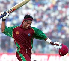 Ramnaresh Sarwan celebrates after smashing the winning boundary of the last ball of Ajit Agarkar