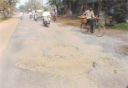 Damaged road between Khanna and Samrala that has beome a traffic hazard for motorists