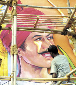 A worker giving finishing touches to a cutout in the Haryana Pavilion at Pragati Maidan for the annual trade fair