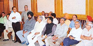 Members of the Chandigarh Beopar Mandal discuss the latest reforms in the rent law, in Sector 7, Chandigarh, on Friday