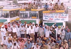 Private bus operators running buses under the kilometre scheme observe a strike in Patiala on Friday