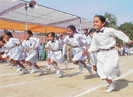 Students of GNIP School sprint towards the finishing line during the schools annual athletic meet in Ludhiana